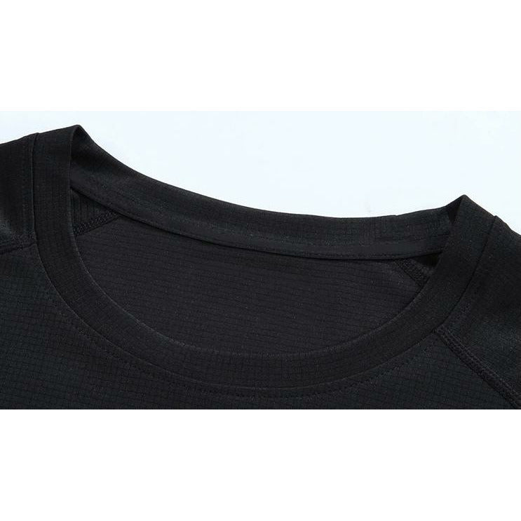 Close up of front of gym shirt showing round neck line seams and dry fit material